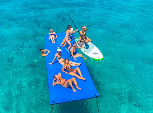 Aerial view of people on a floating mat