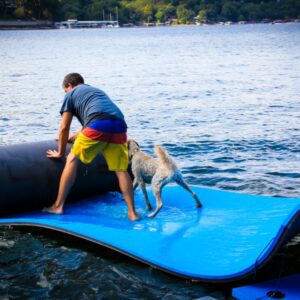 Man with a dog rolling a floating mat